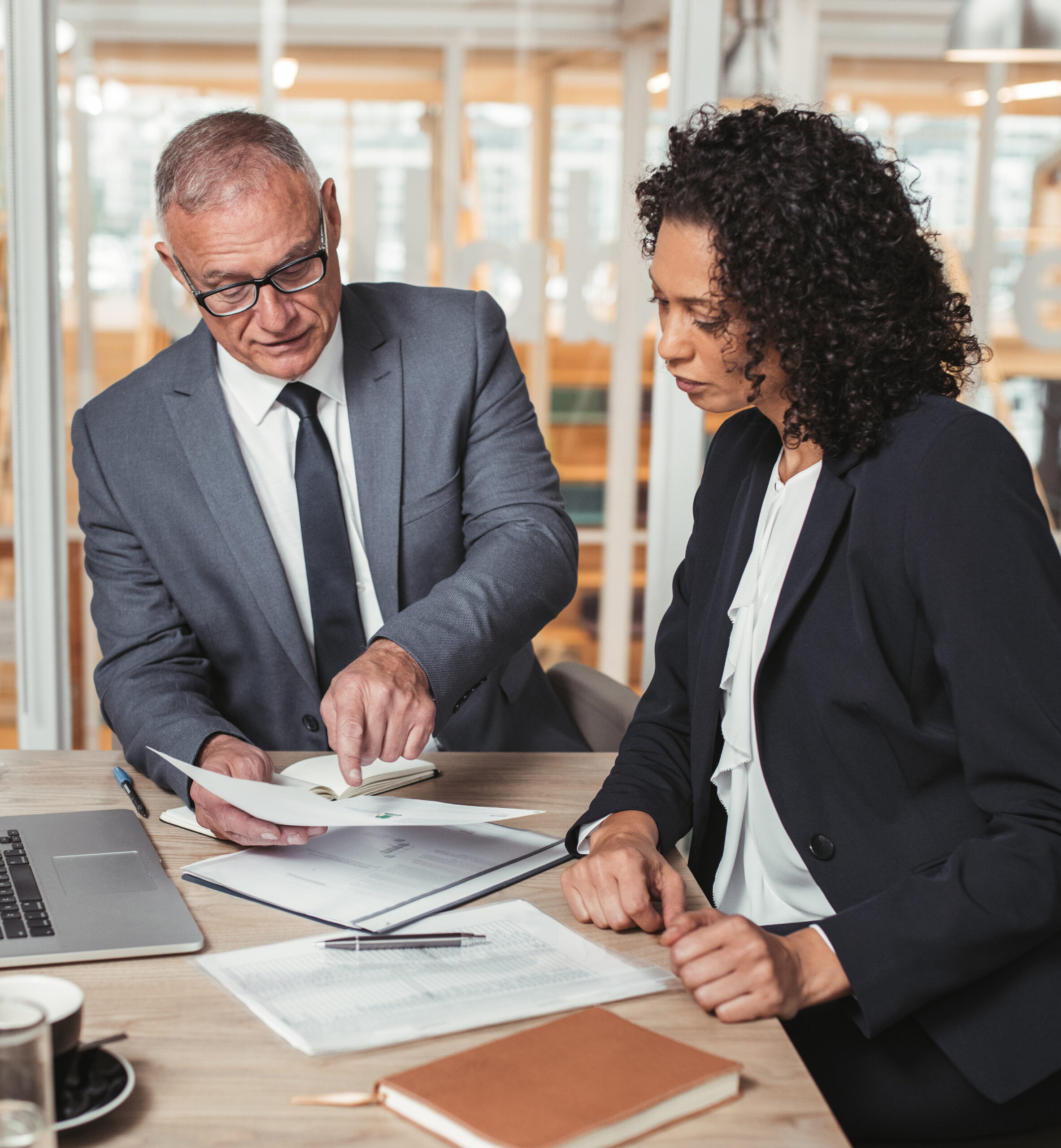 Man and women reviewing financial reports