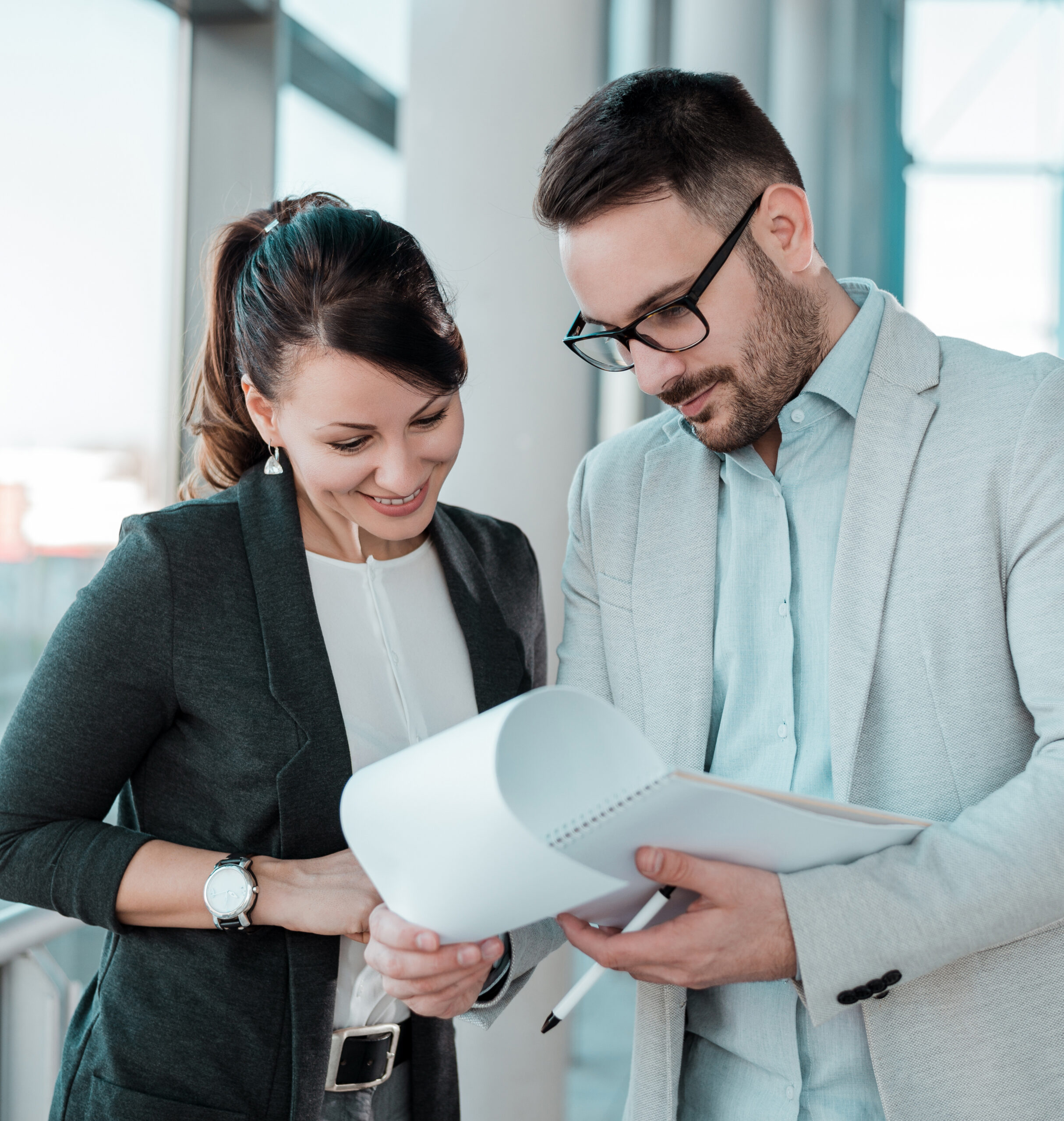 Two businesspeople having meeting in office hall