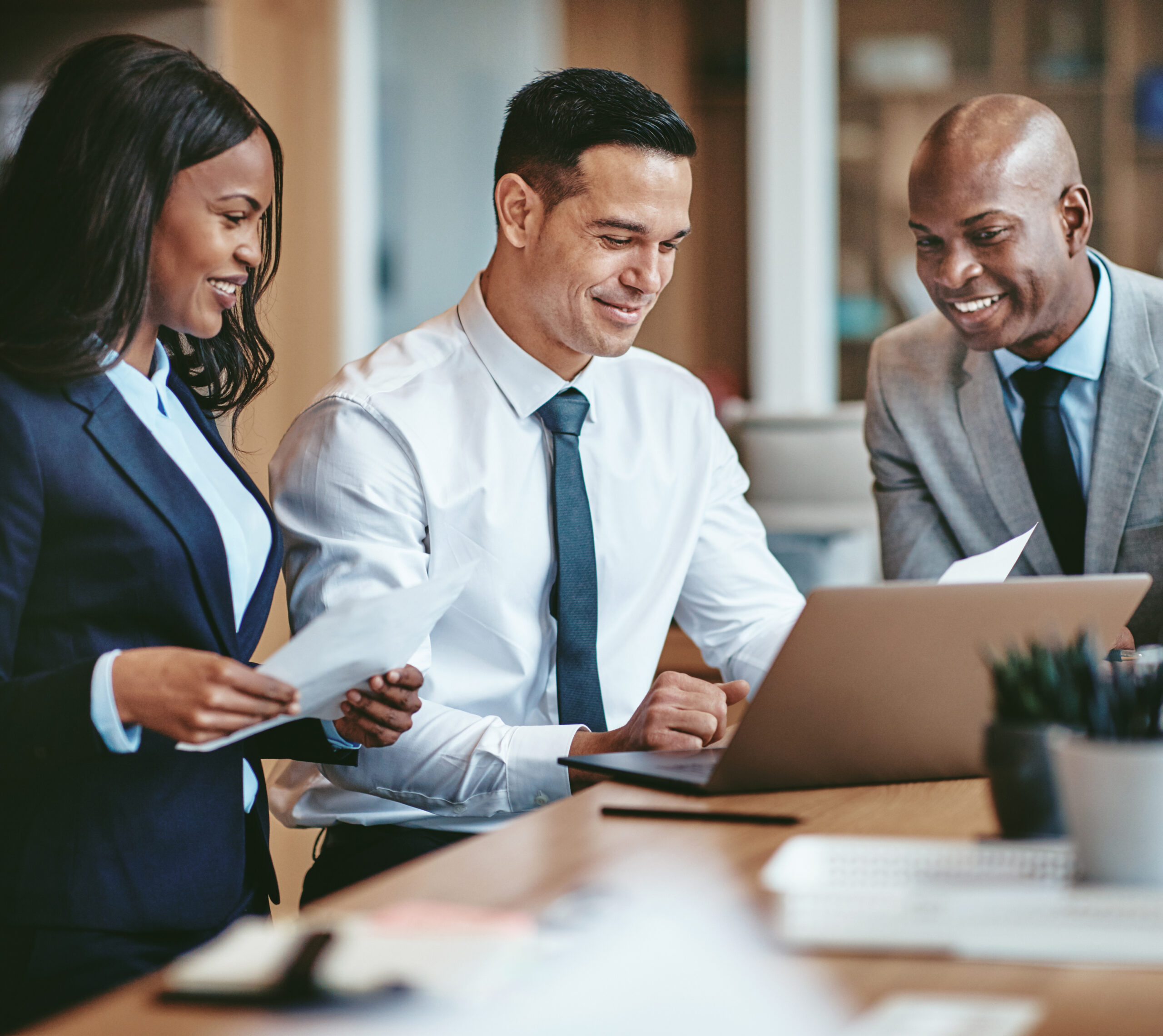 Diverse group of smiling businesspeople working in an office