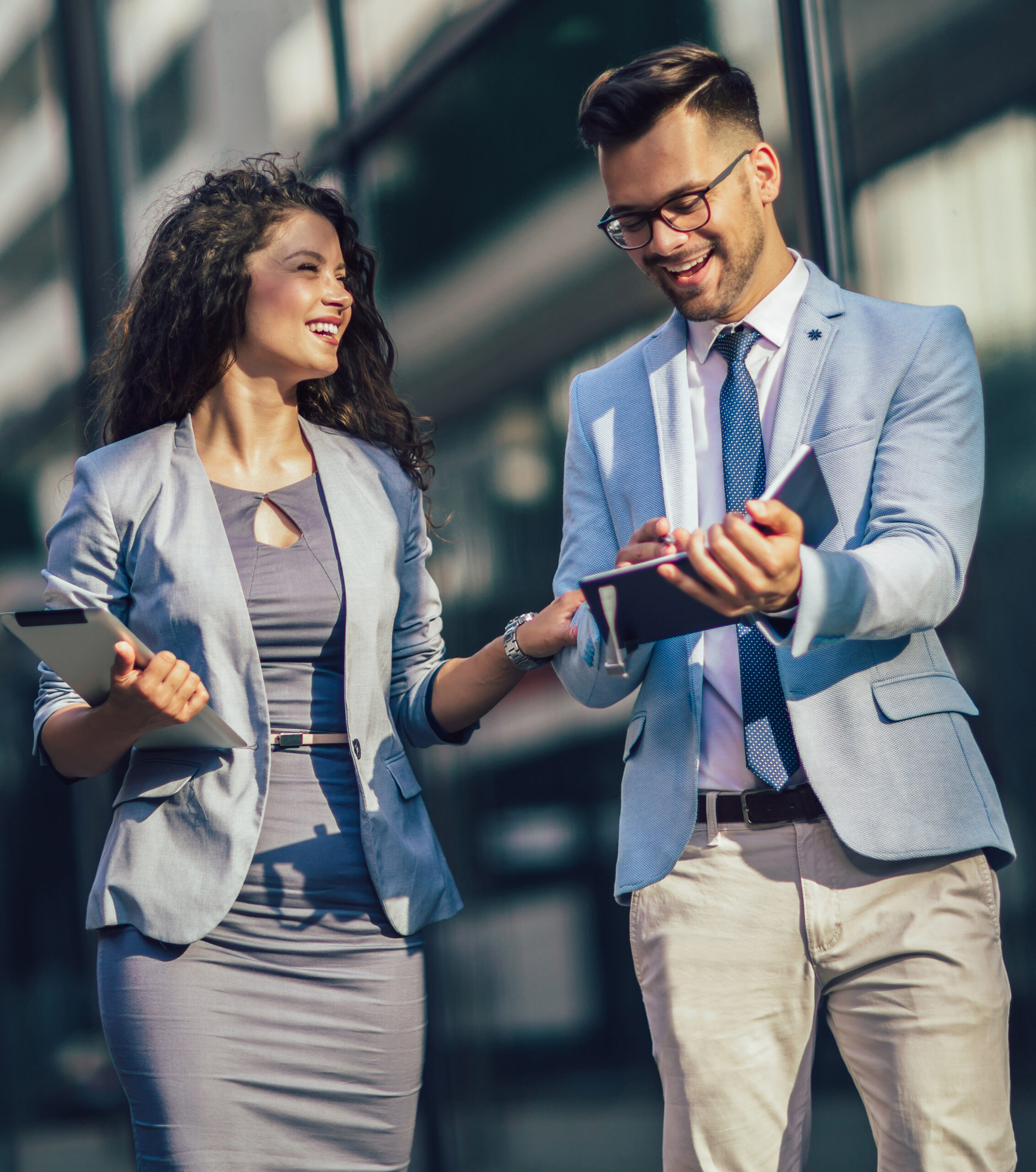 Business partners using digital tools to review financials