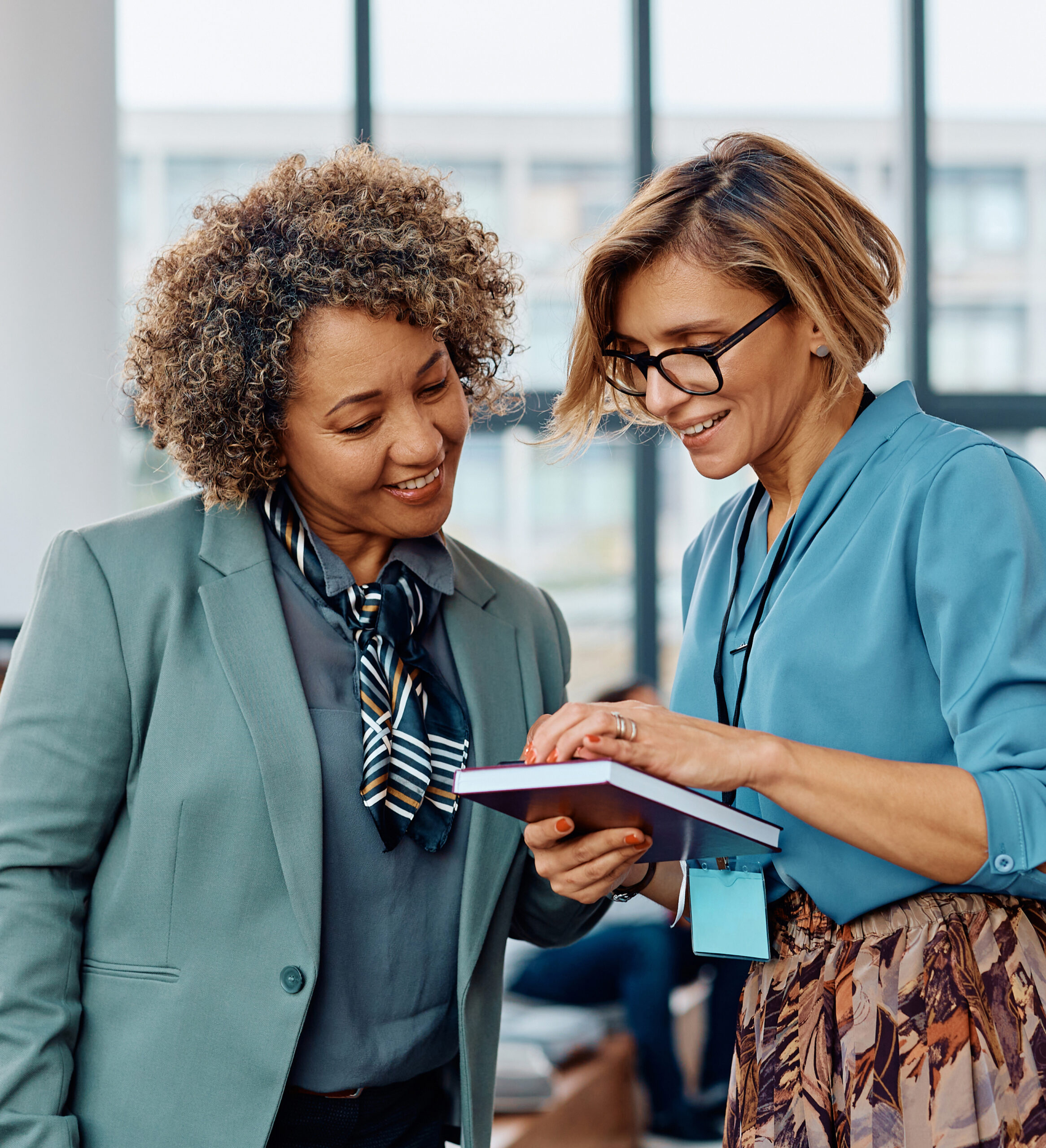 Two women reviewing financial reports