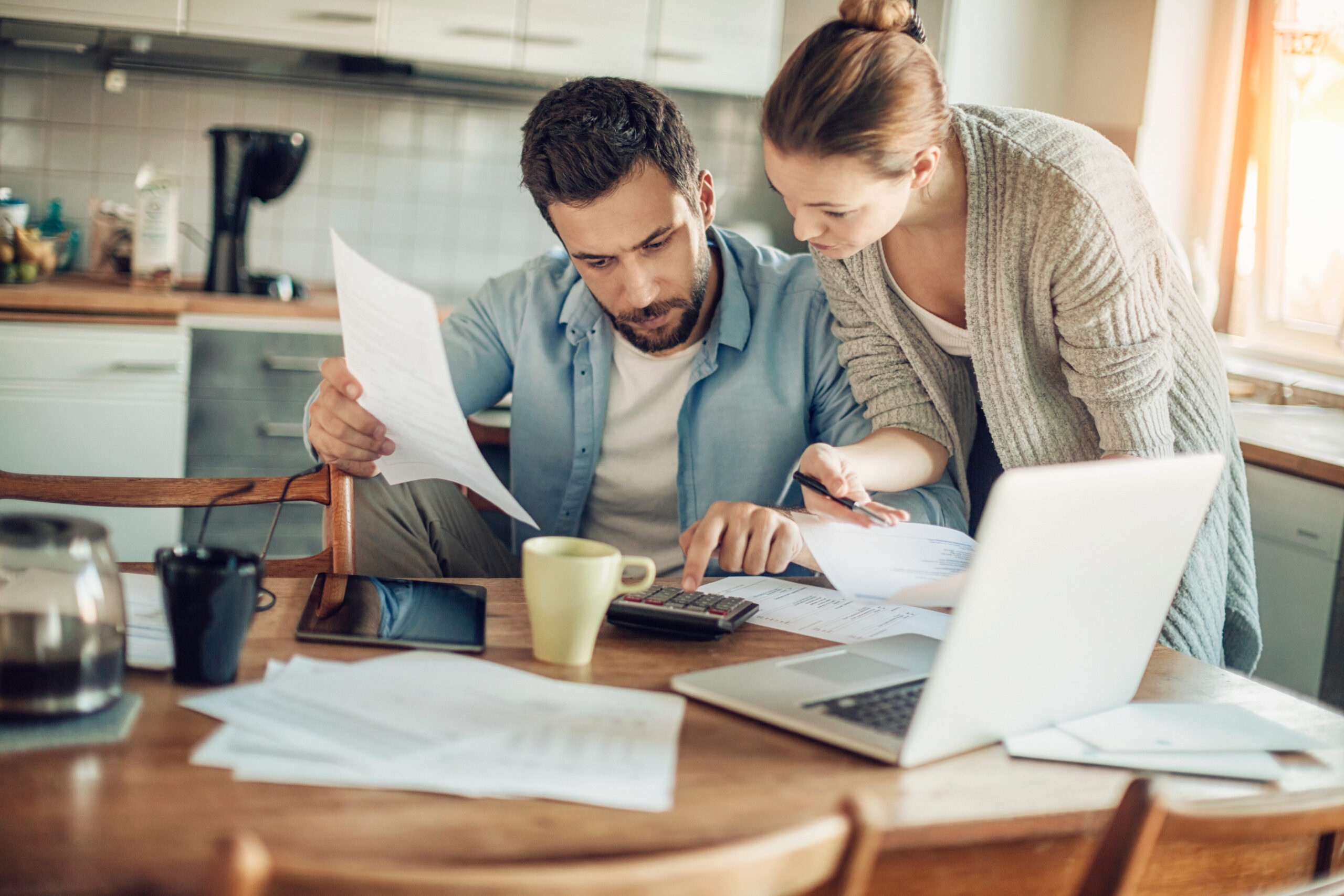 Young couple going over their bills and home finances