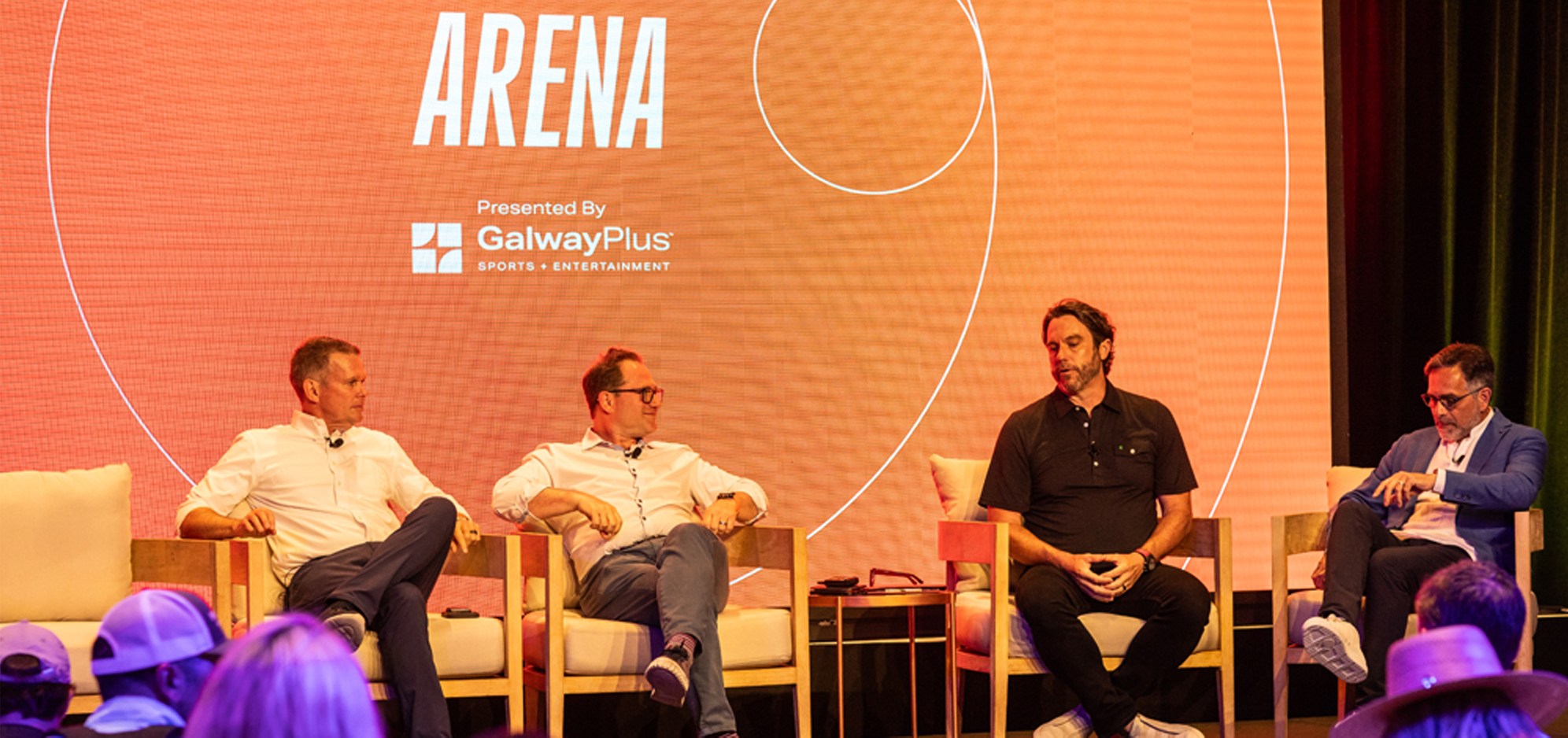 Panel of speakers on stage