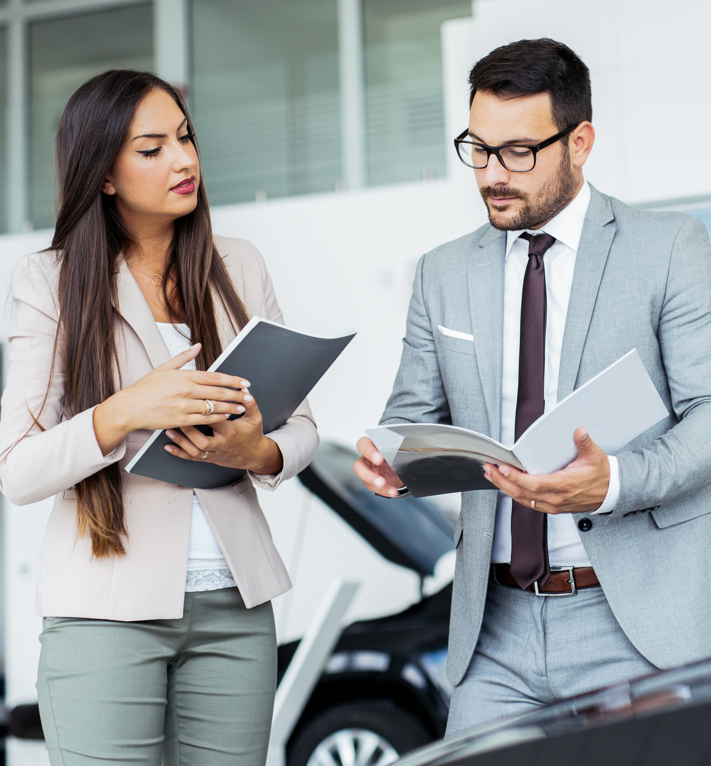 Man and woman looking at a brochure