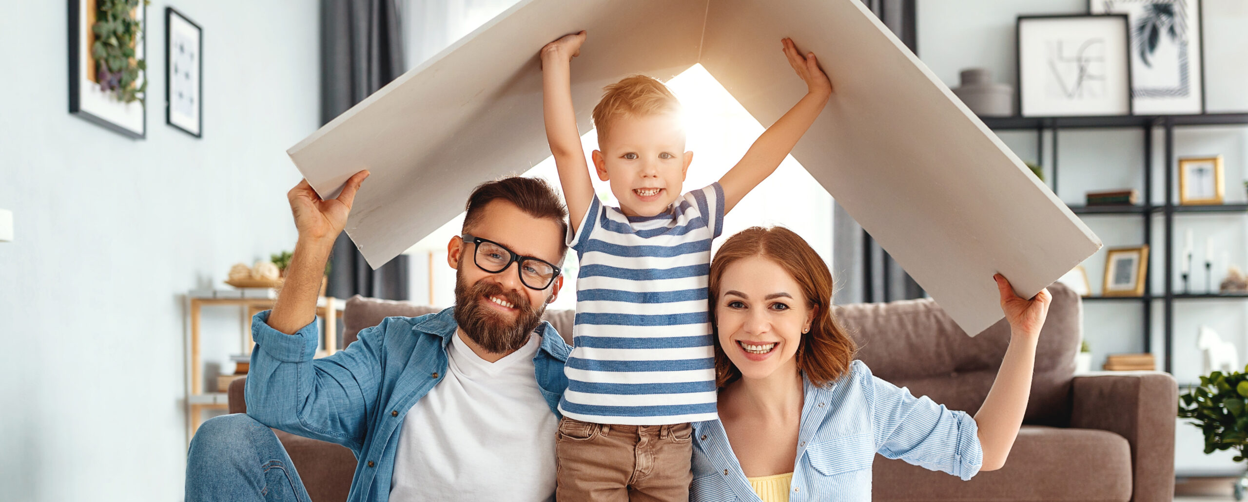 Parents with a child sitting in their home
