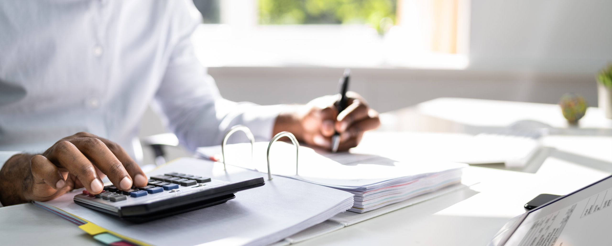 Businessman using a calculator