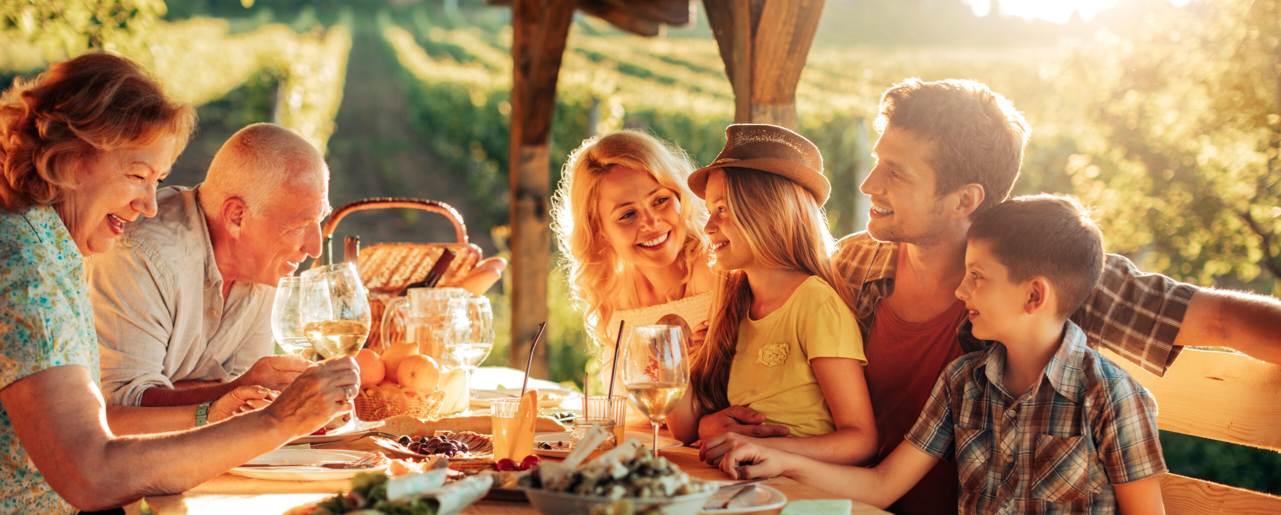 Happy multigenerational family enjoying dinner outdoors