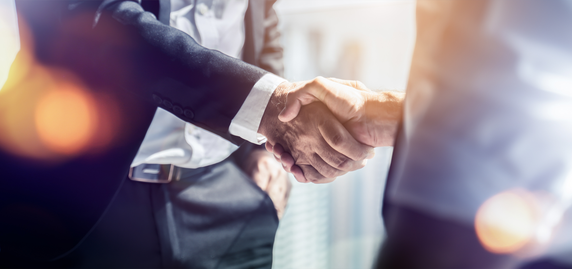 Hands shaking hands to close a deal